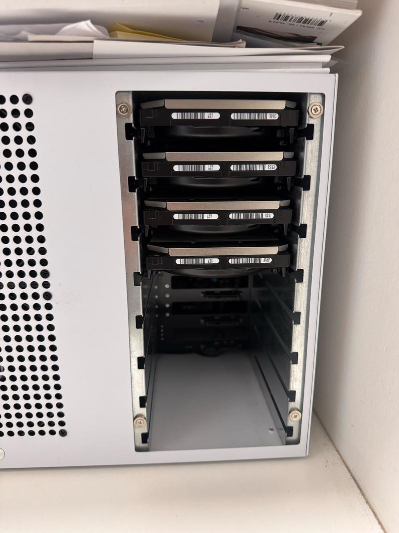 The NAS drive bays populated with hard drives